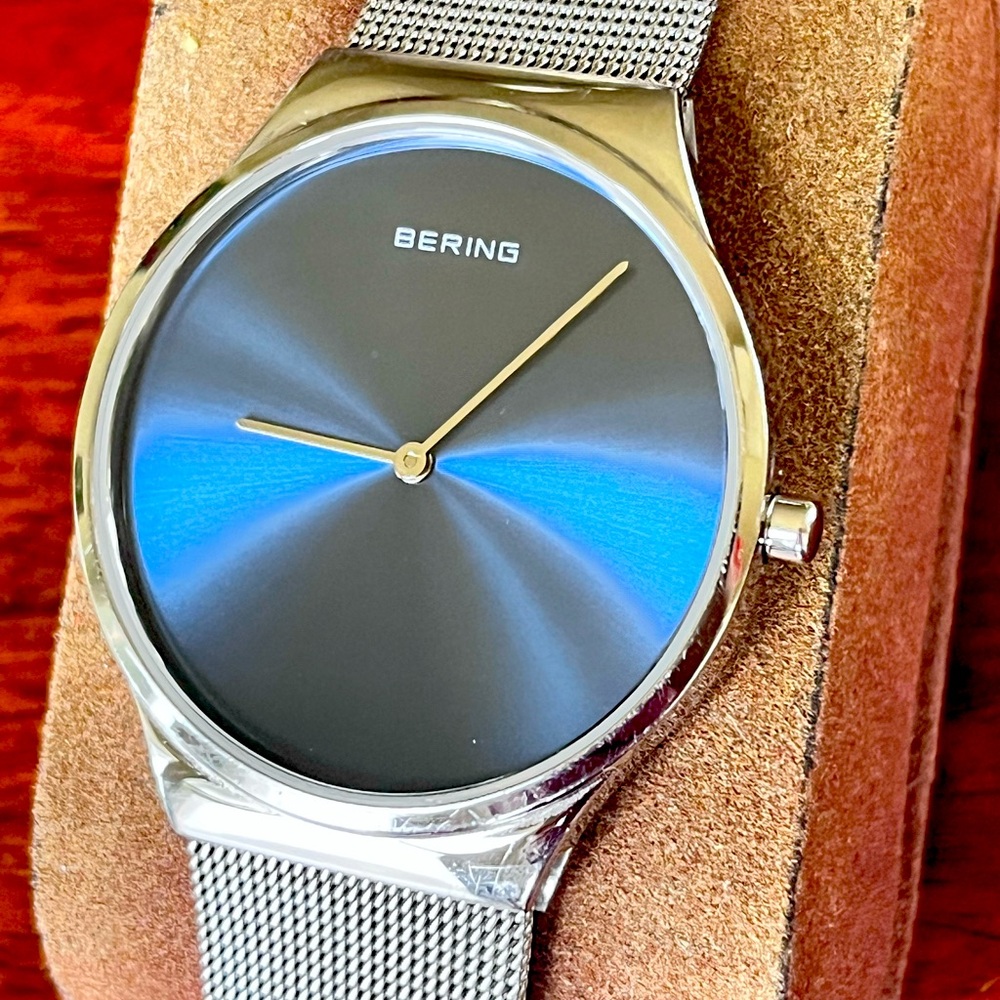 Bering shimmering blue dial 38mm ultra thin quartz watch. Pre-owned.